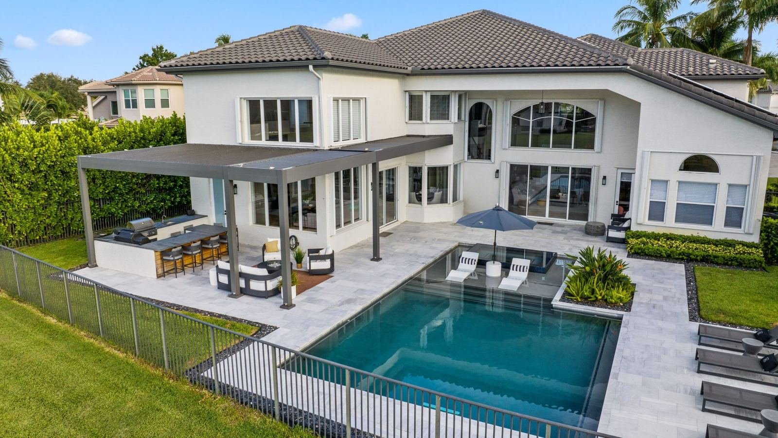 Gulf Coast home with a custom pool and covered terrace