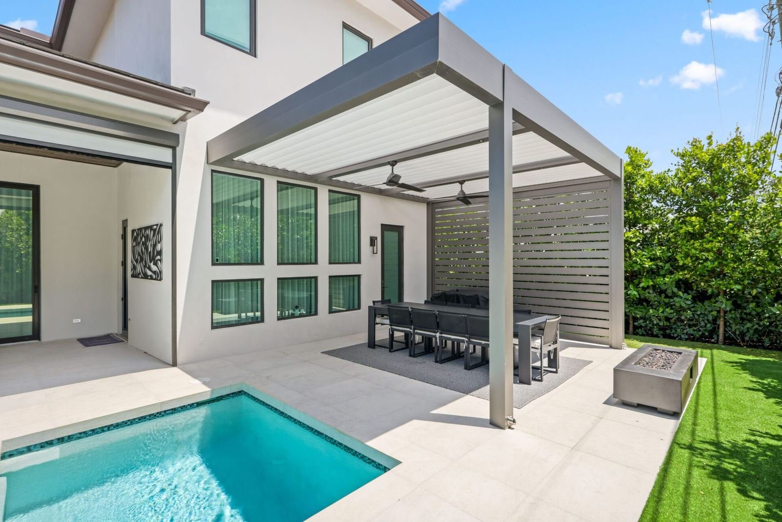 Custom pool beside a covered outdoor living area