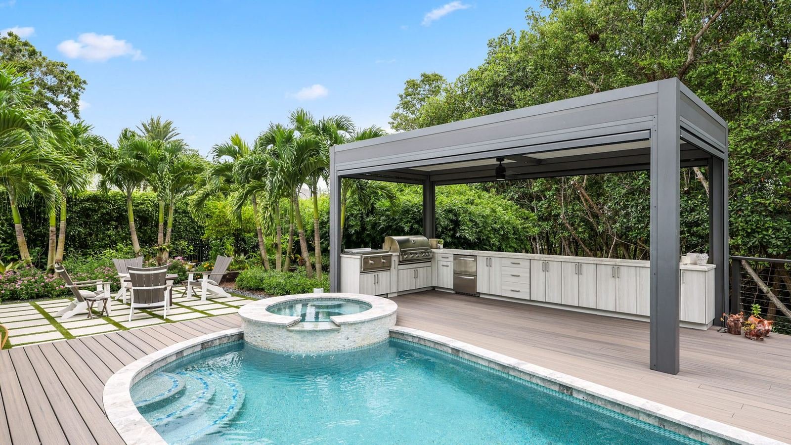 Custom pool with spa, loungers and a pergola