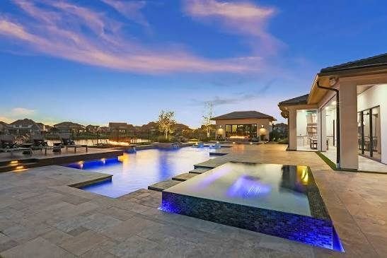 Pool with coloured lighting at dusk